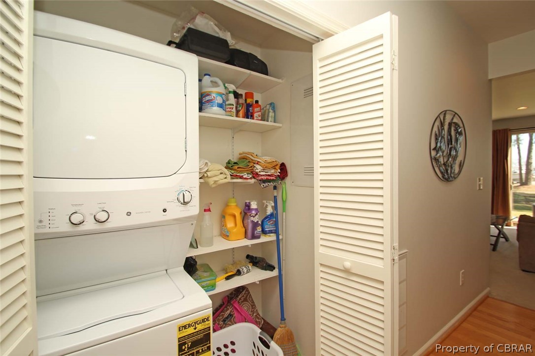 6819 Windmill Point Road White Stone, VA 22578 - Photo 15 of 50 Cleaning closet & washer & dryer just off the main floor ensuite bedroom