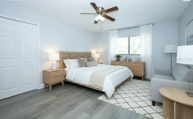 a bedroom with a bed and a couch