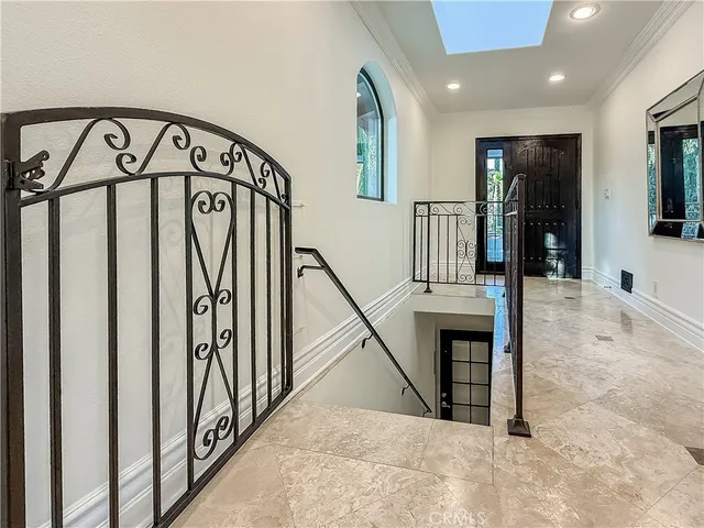 a kitchen with stainless steel appliances granite countertop a sink a stove and a refrigerator