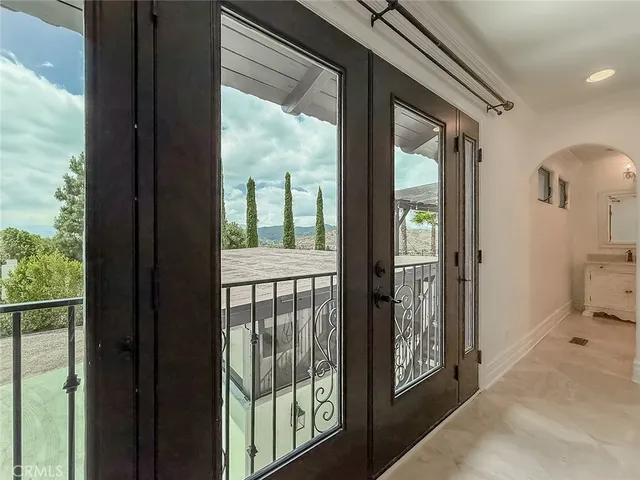 a kitchen with stainless steel appliances granite countertop a sink and a refrigerator