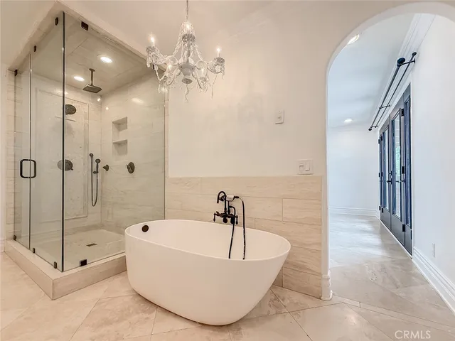 a bathroom with a shower a toilet and a sink