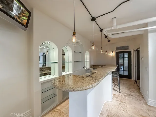 an aerial view of residential house with an outdoor space and seating