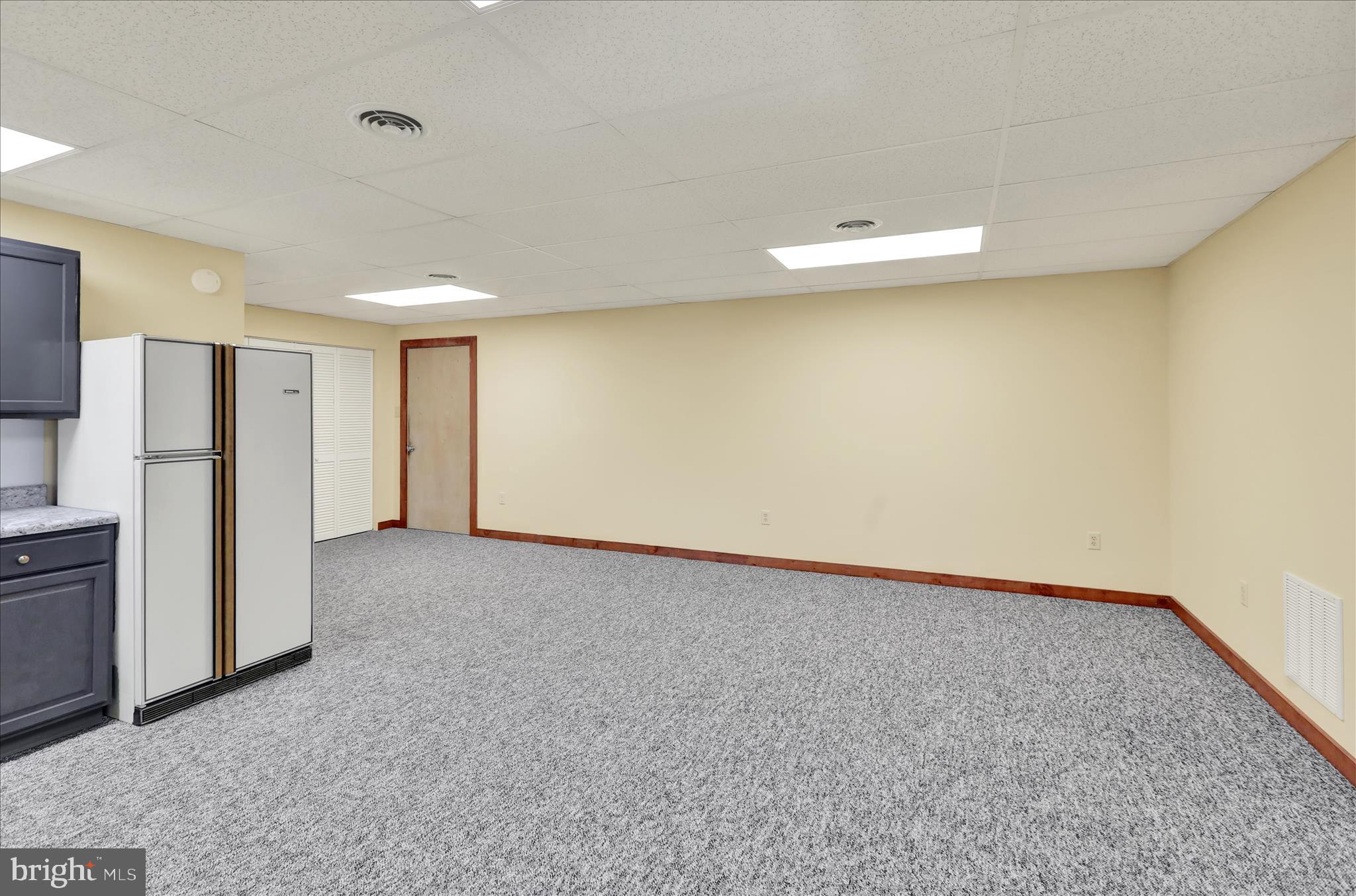 392 5 Locks Road Shoemakersville, PA 19555 - Photo 2 of 11 a view of an empty room with a window