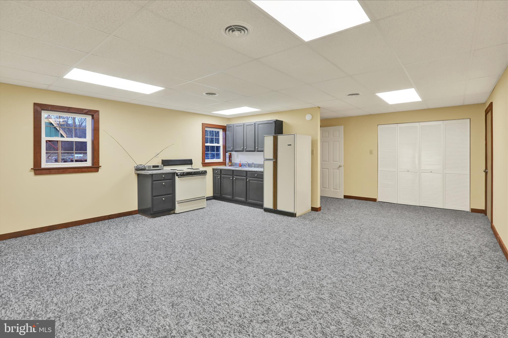392 5 Locks Road Shoemakersville, PA 19555 - Photo 4 of 11 a view of a kitchen with a sink refrigerator and a cabinets