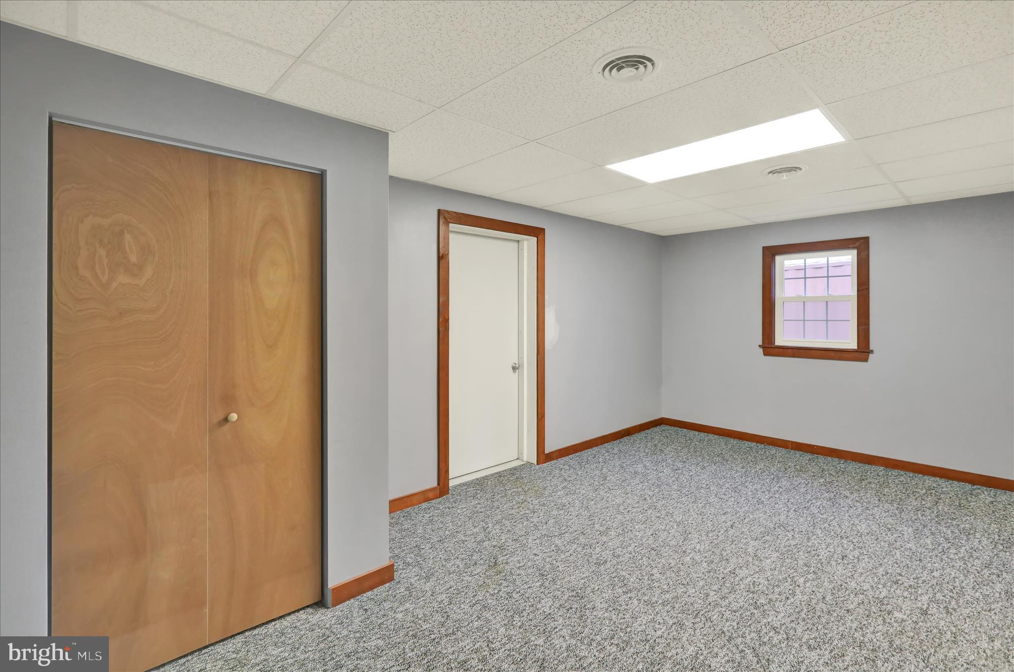 392 5 Locks Road Shoemakersville, PA 19555 - Photo 8 of 11 a view of an empty room with a window