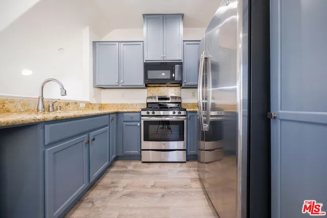 a bath room with a sink double vanity and a bathtub