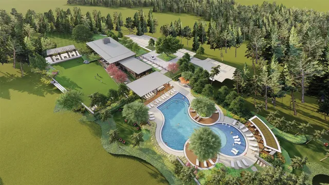 an aerial view of a house with outdoor space and lake view