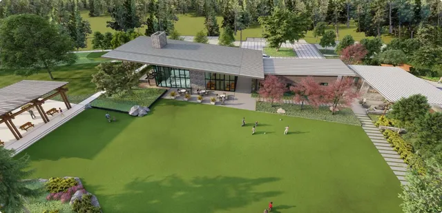 an aerial view of a house with swimming pool garden view and trees