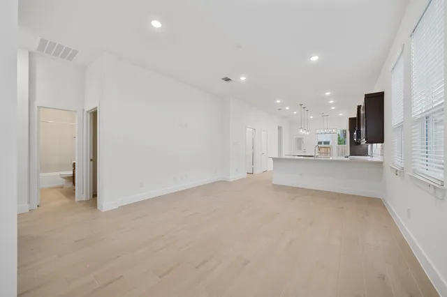 a view of a kitchen with a sink and cabinets