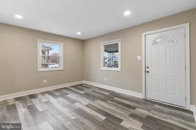 a view of room with window and wooden floor