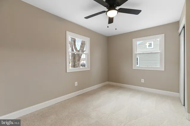 a view of hallway with wooden floor