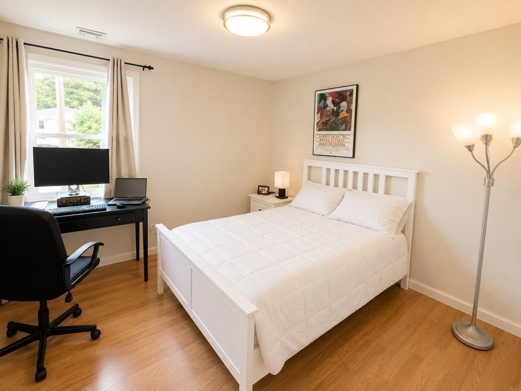 38 Crescent Road, Unit 38 Needham, MA 02494 - Photo 7 of 23 a bedroom with a bed and a desk