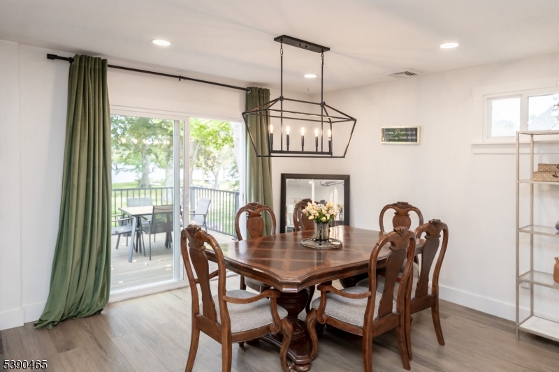 11 Washington Street Landing, NJ 07850 - Photo 15 of 45 a dining room with furniture a chandelier and wooden floor