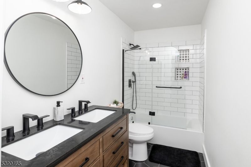 11 Washington Street Landing, NJ 07850 - Photo 17 of 45 a bathroom with a granite countertop sink mirror toilet and bathtub