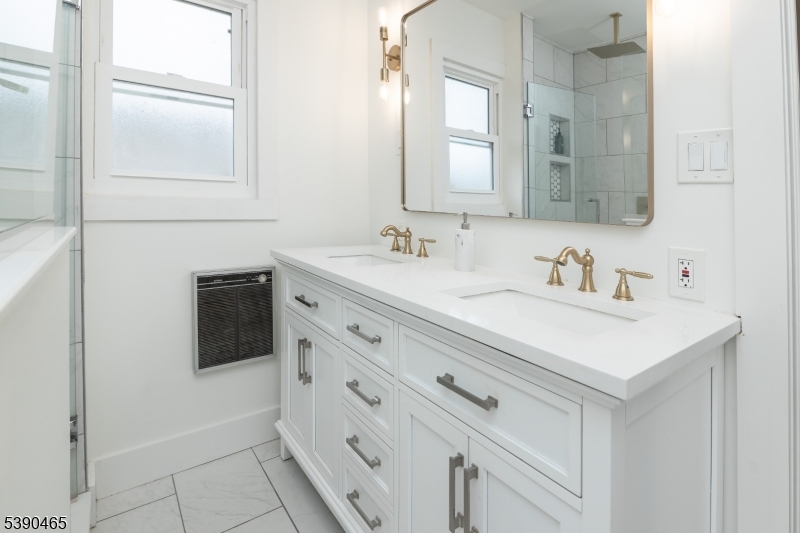 11 Washington Street Landing, NJ 07850 - Photo 20 of 45 a bathroom with a sink a vanity and a mirror