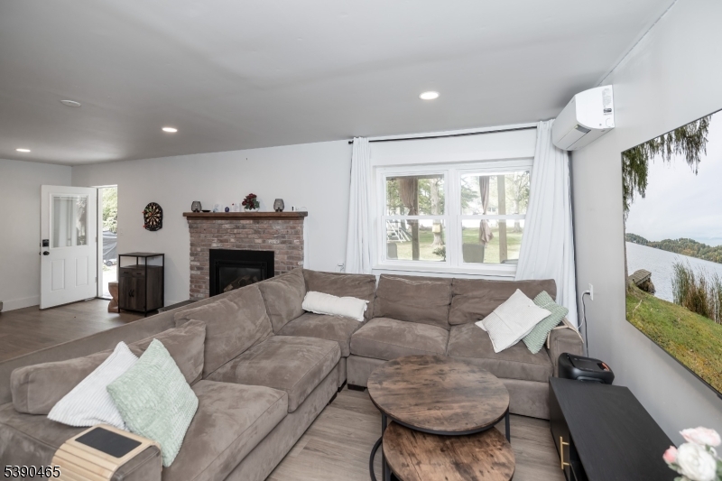 11 Washington Street Landing, NJ 07850 - Photo 26 of 45 a living room with furniture and a fireplace