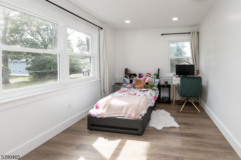 11 Washington Street Landing, NJ 07850 - Photo 27 of 45 a bedroom with a bed and wooden floor