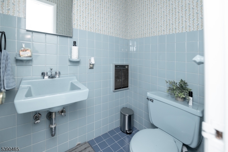 11 Washington Street Landing, NJ 07850 - Photo 29 of 45 a bathroom with a toilet sink and mirror