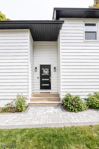 11 Washington Street Landing, NJ 07850 - Photo 3 of 45 a front view of a house with a yard and garage