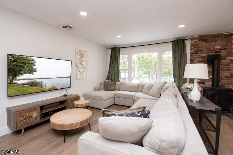 11 Washington Street Landing, NJ 07850 - Photo 6 of 45 a living room with furniture and a flat screen tv