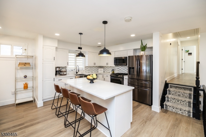 11 Washington Street Landing, NJ 07850 - Photo 10 of 45 a kitchen with stainless steel appliances a refrigerator a stove top oven a sink dishwasher and a refrigerator