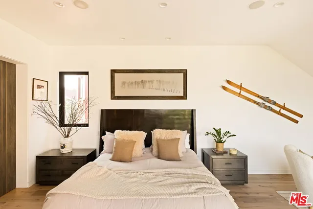 a view of a balcony with wooden floor and fence