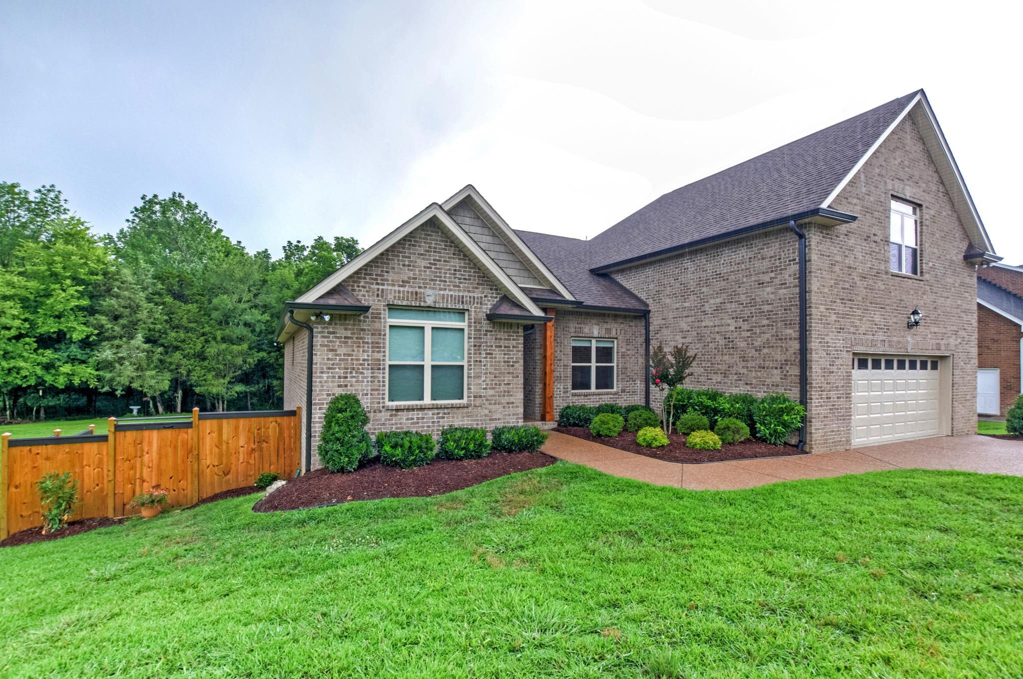 158 Abbey Road Lebanon, TN 37090 - Photo 2 of 30 a front view of a house with a garden and plants