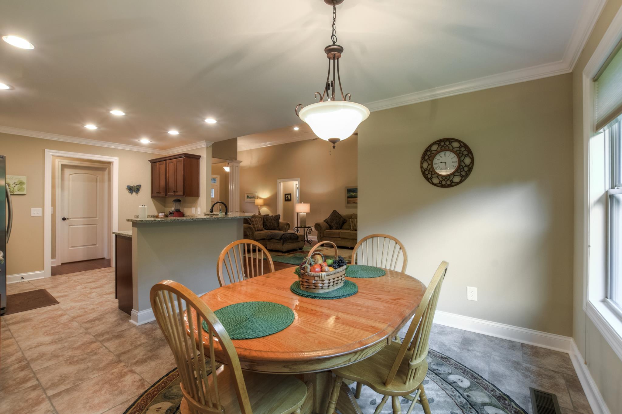 158 Abbey Road Lebanon, TN 37090 - Photo 11 of 30 a dining room with furniture a chandelier and wooden floor