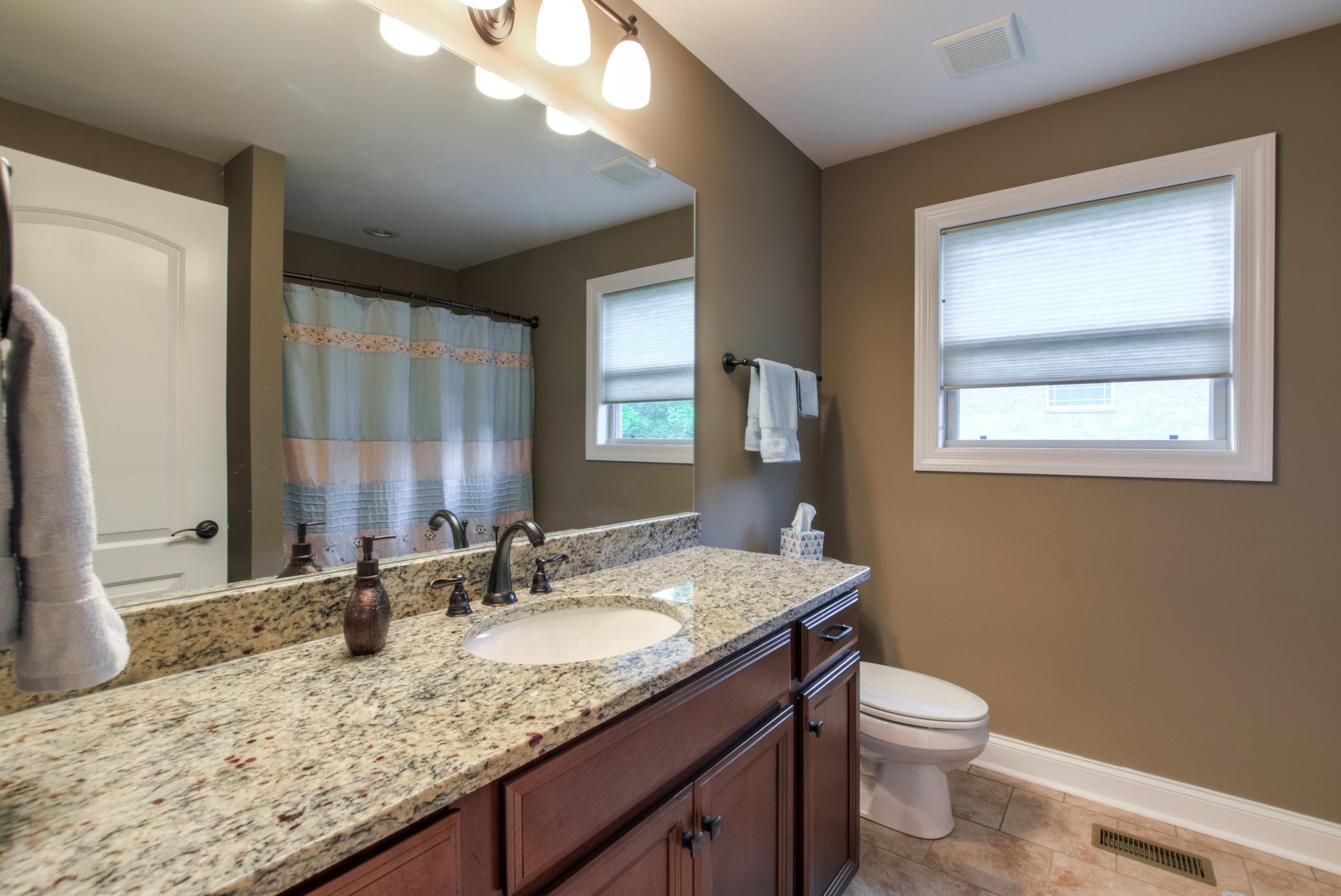 158 Abbey Road Lebanon, TN 37090 - Photo 12 of 30 a bathroom with a granite countertop sink toilet and mirror