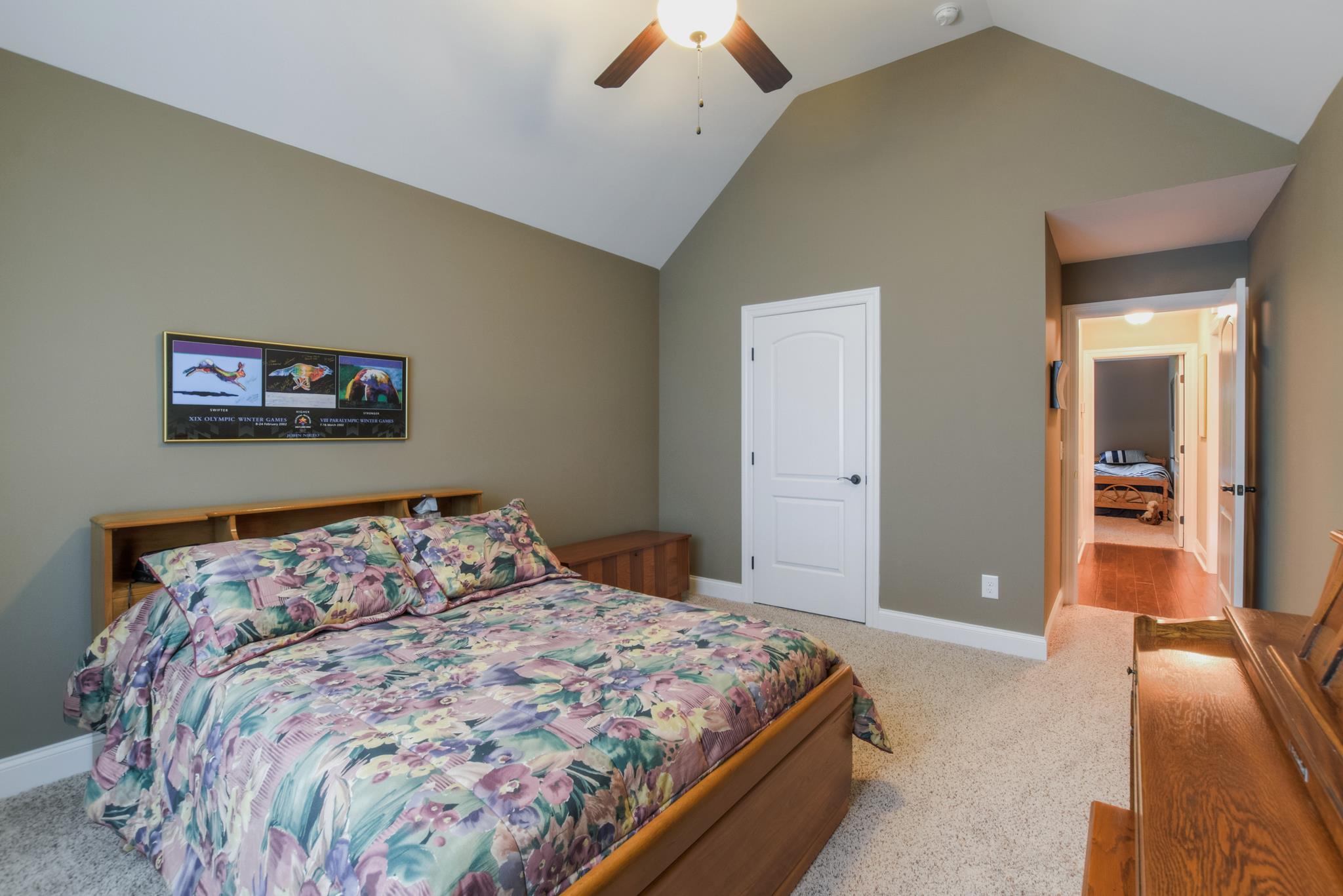158 Abbey Road Lebanon, TN 37090 - Photo 13 of 30 a bedroom with a large bed and a chandelier