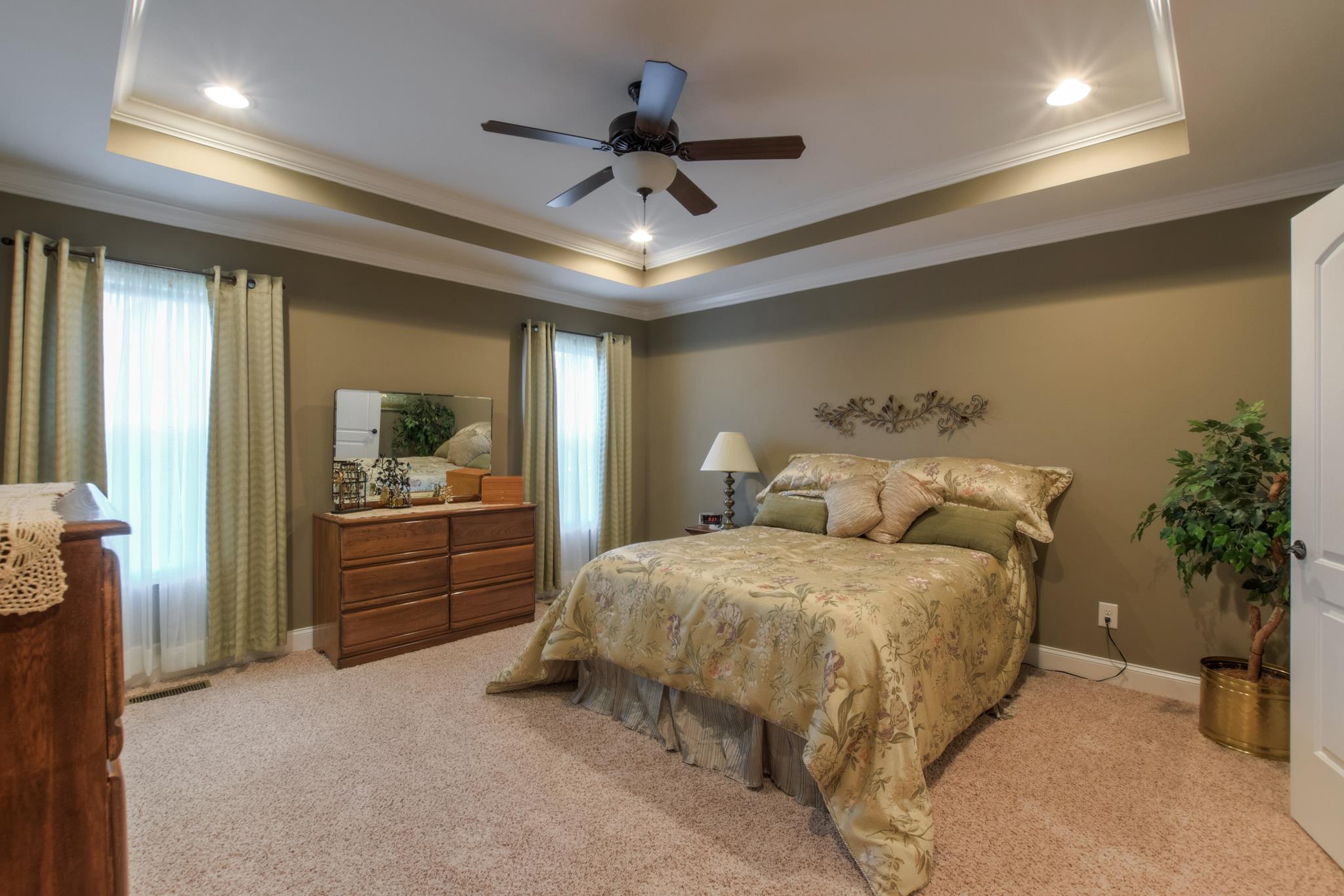 158 Abbey Road Lebanon, TN 37090 - Photo 15 of 30 a spacious bedroom with a bed and a potted plant