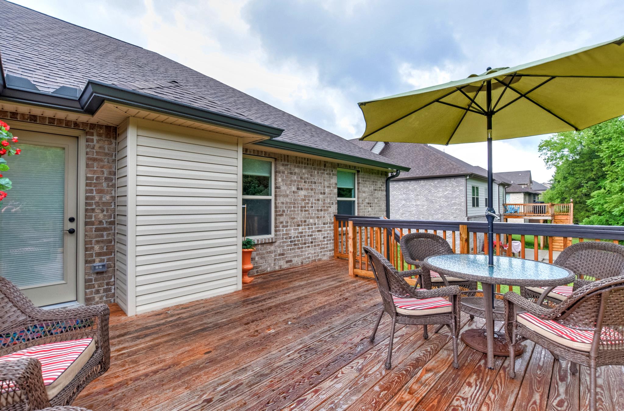 158 Abbey Road Lebanon, TN 37090 - Photo 28 of 30 a patio with wooden floor a yard a table and chairs
