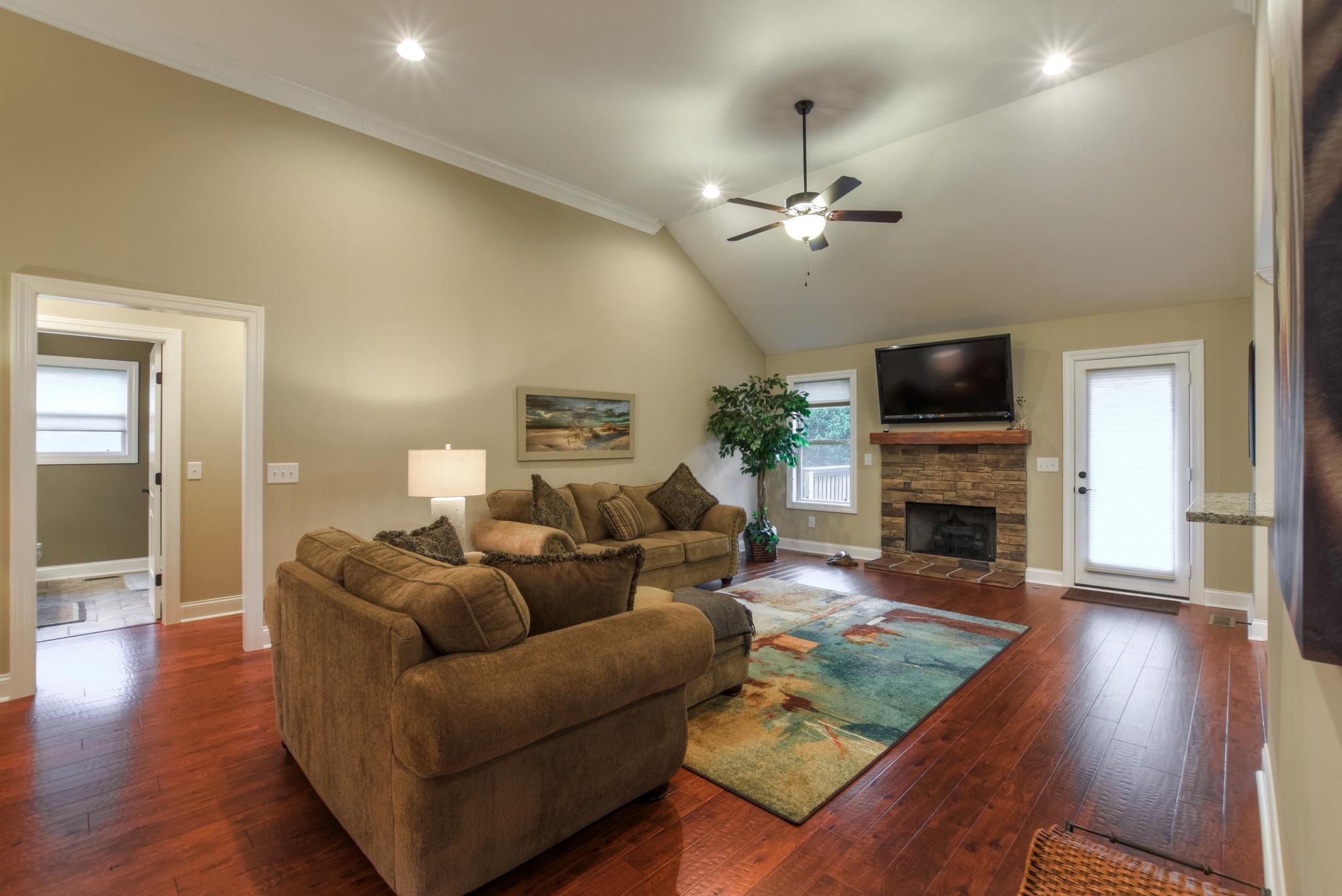158 Abbey Road Lebanon, TN 37090 - Photo 5 of 30 a living room with furniture a fireplace and a flat screen tv