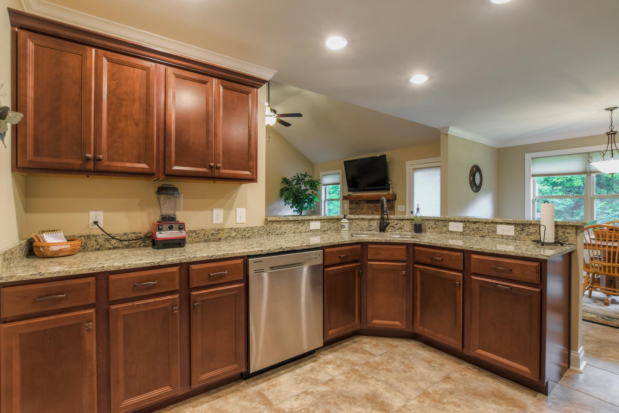 158 Abbey Road Lebanon, TN 37090 - Photo 8 of 30 a kitchen with stainless steel appliances granite countertop wooden cabinets a sink and dishwasher