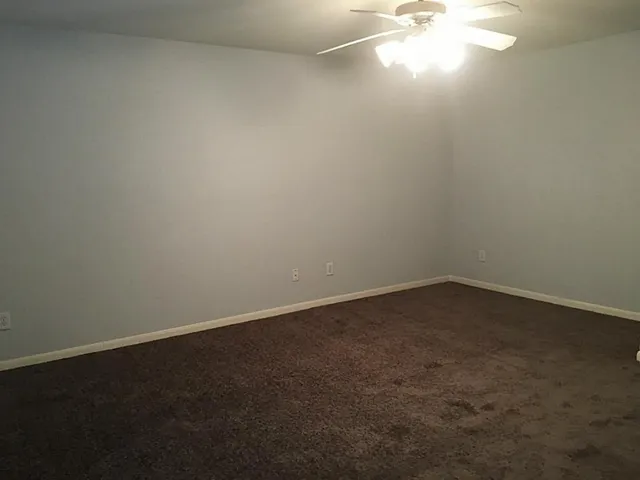 an empty room with a empty space and a window