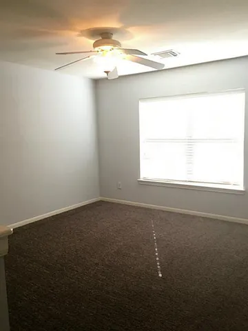 a view of a window in an empty room