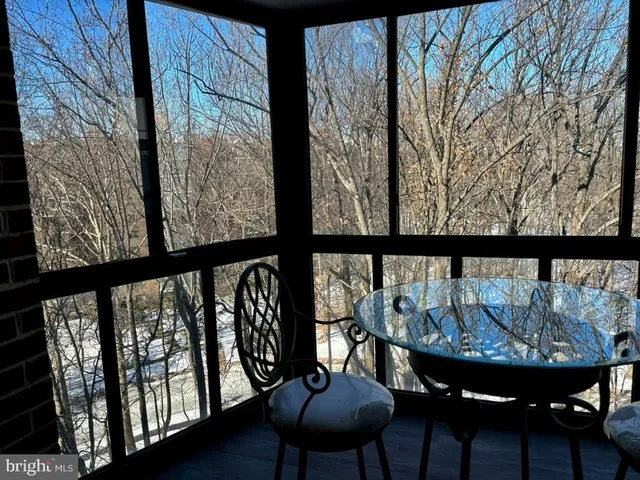 a view of roof deck with furniture