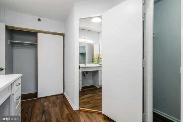 a view of hallway with wooden floor