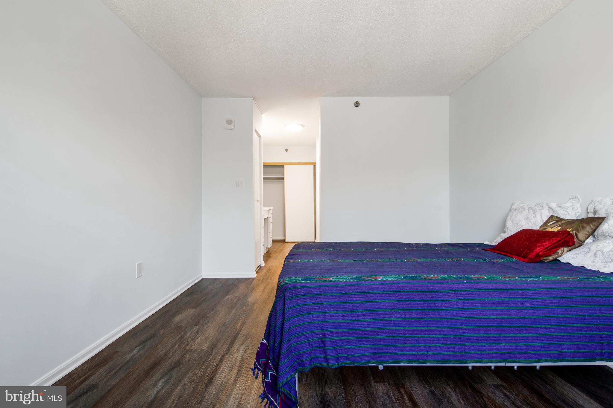 15115 Interlachen Drive, Unit 31020 Silver Spring, MD 20906 - Photo 34 of 48 a bedroom with a bed and a window