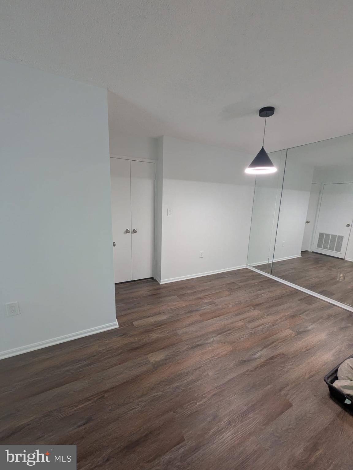 15115 Interlachen Drive, Unit 31020 Silver Spring, MD 20906 - Photo 46 of 48 a view of empty room with wooden floor