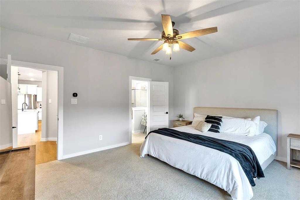 6105 Poolside Way Royse City, TX 75189 - Photo 6 of 12 a bedroom with bed and a chandelier