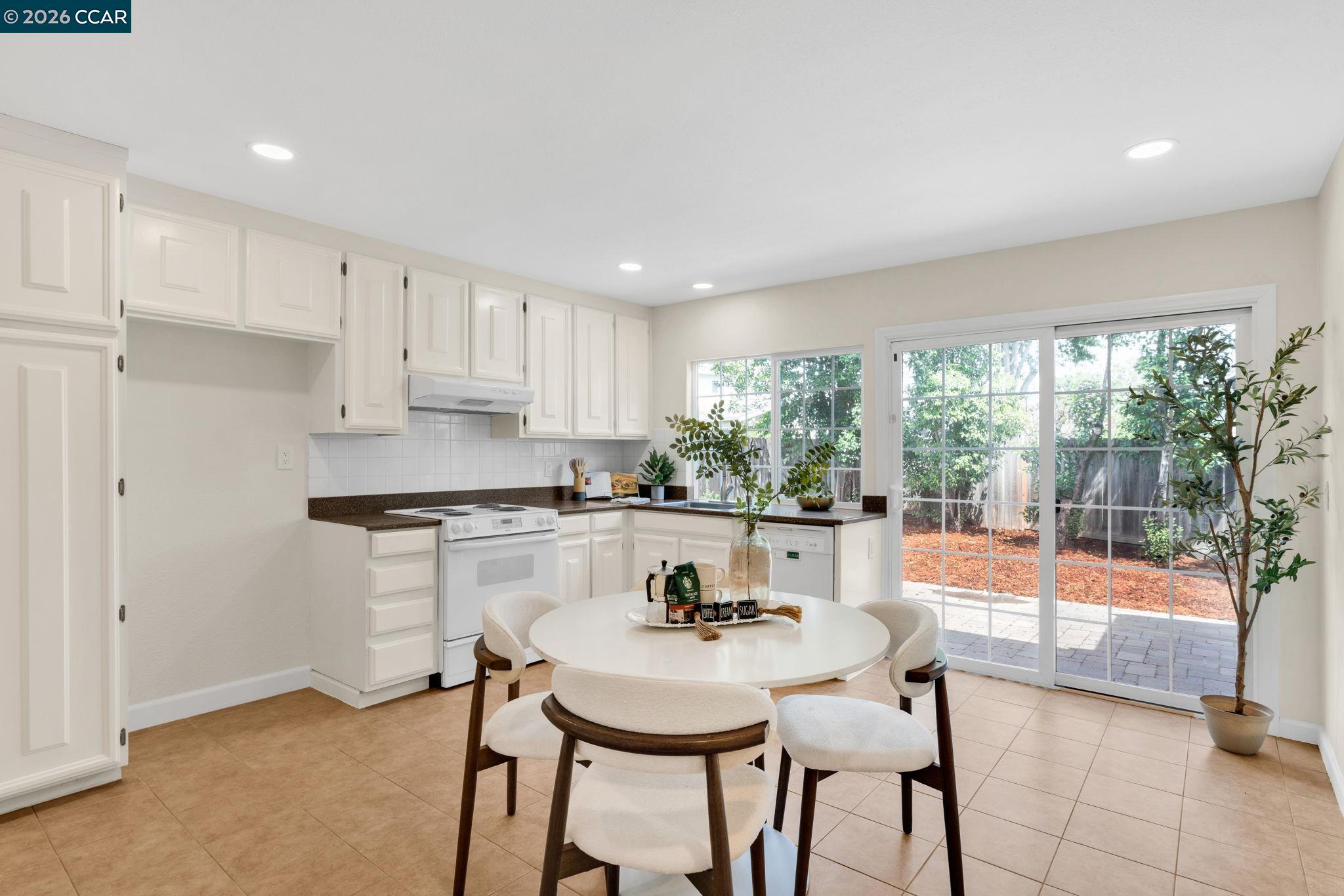 32 Yale Court San Ramon, CA 94583 - Photo 12 of 40 a kitchen with a table chairs and window
