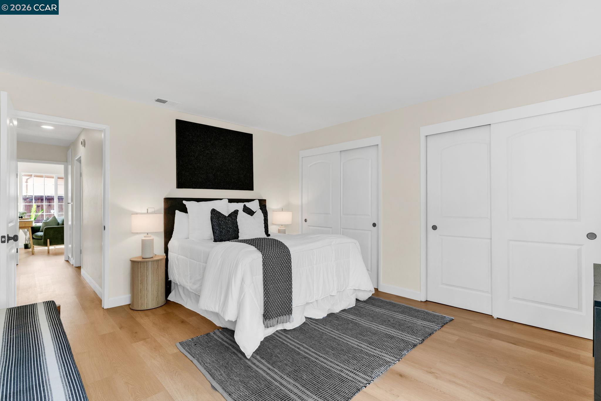 32 Yale Court San Ramon, CA 94583 - Photo 19 of 40 a spacious bedroom with a bed and wooden floor