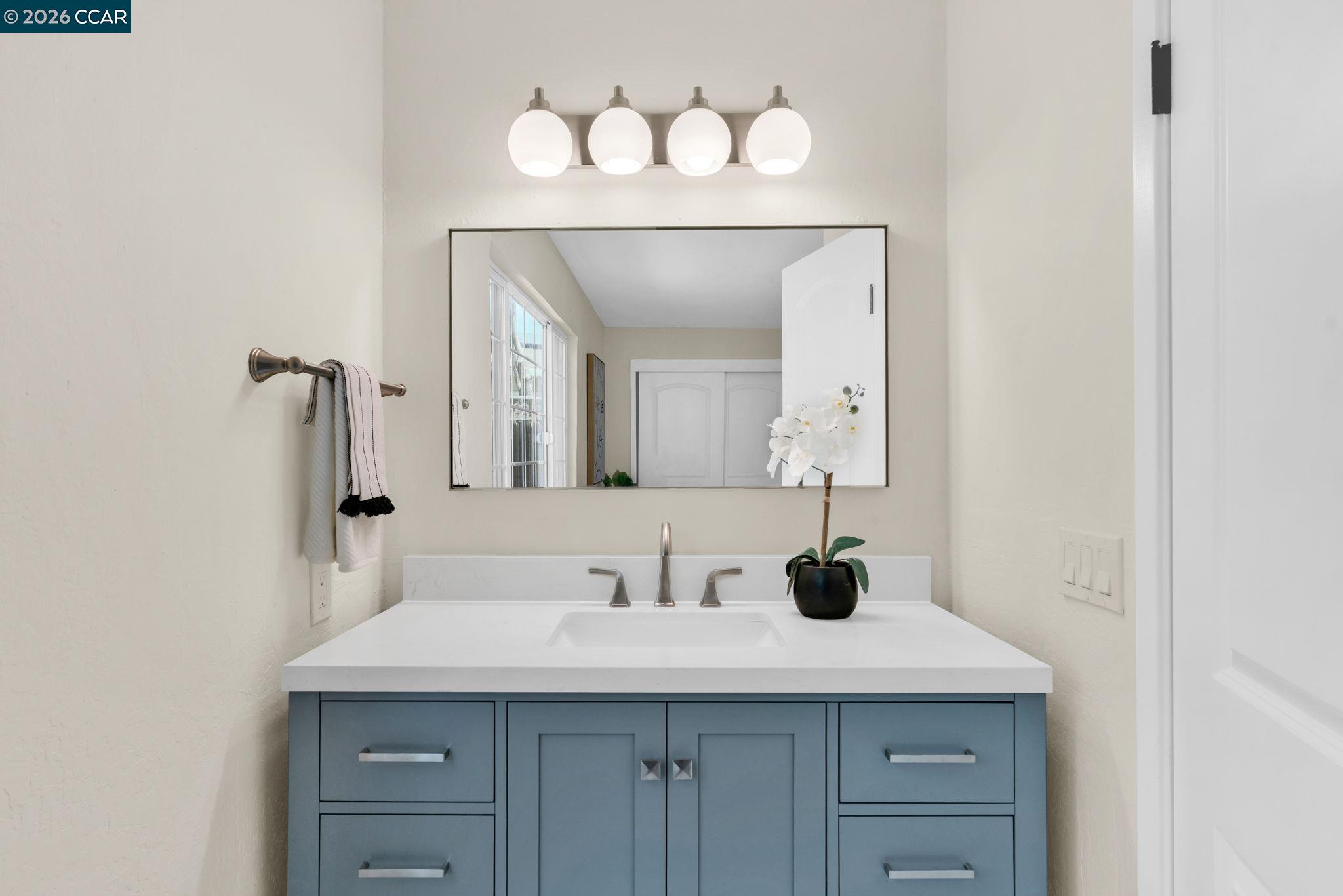 32 Yale Court San Ramon, CA 94583 - Photo 23 of 40 a bathroom with a sink and a mirror