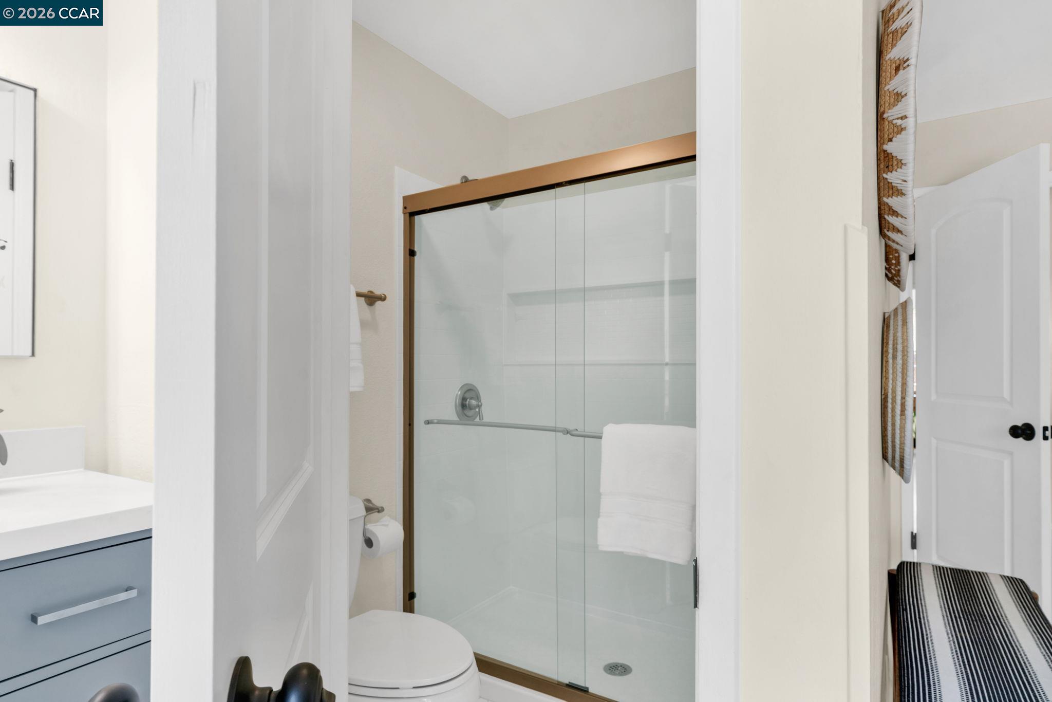 32 Yale Court San Ramon, CA 94583 - Photo 26 of 40 a bathroom with a shower and a toilet