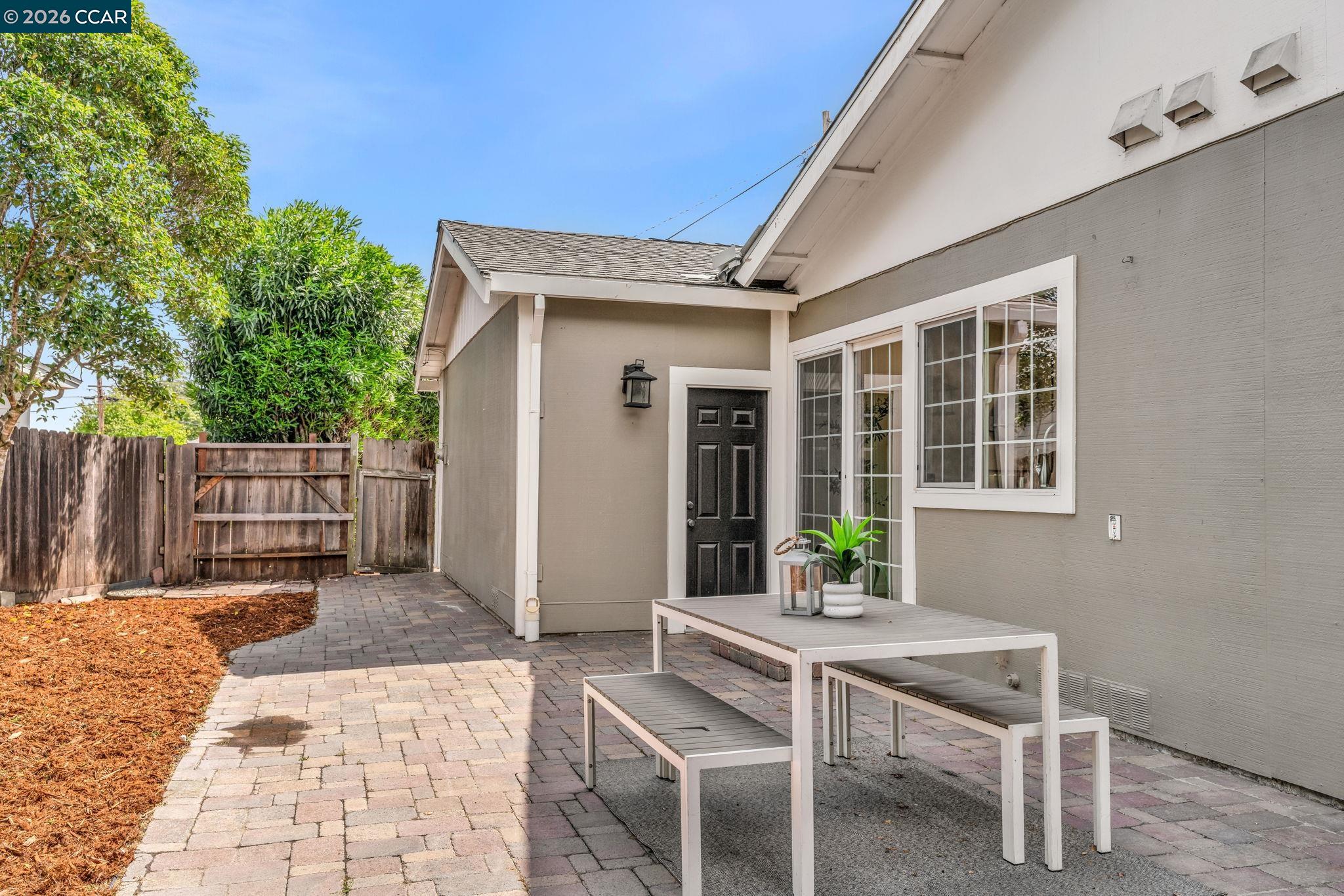 32 Yale Court San Ramon, CA 94583 - Photo 31 of 40 a view of a patio with table and chairs and wooden fence