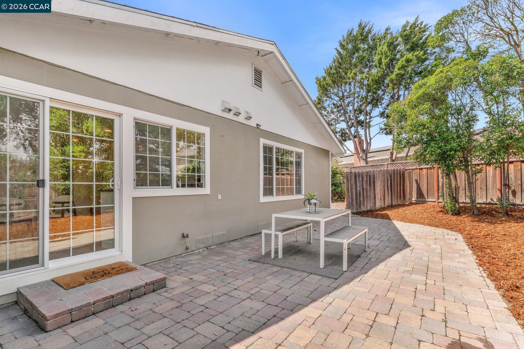 32 Yale Court San Ramon, CA 94583 - Photo 33 of 40 a view of a backyard with table and chairs and wooden fence