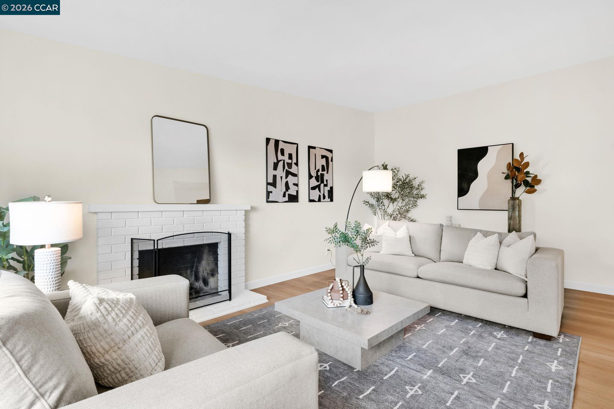 32 Yale Court San Ramon, CA 94583 - Photo 7 of 40 a living room with furniture a fireplace and a potted plant
