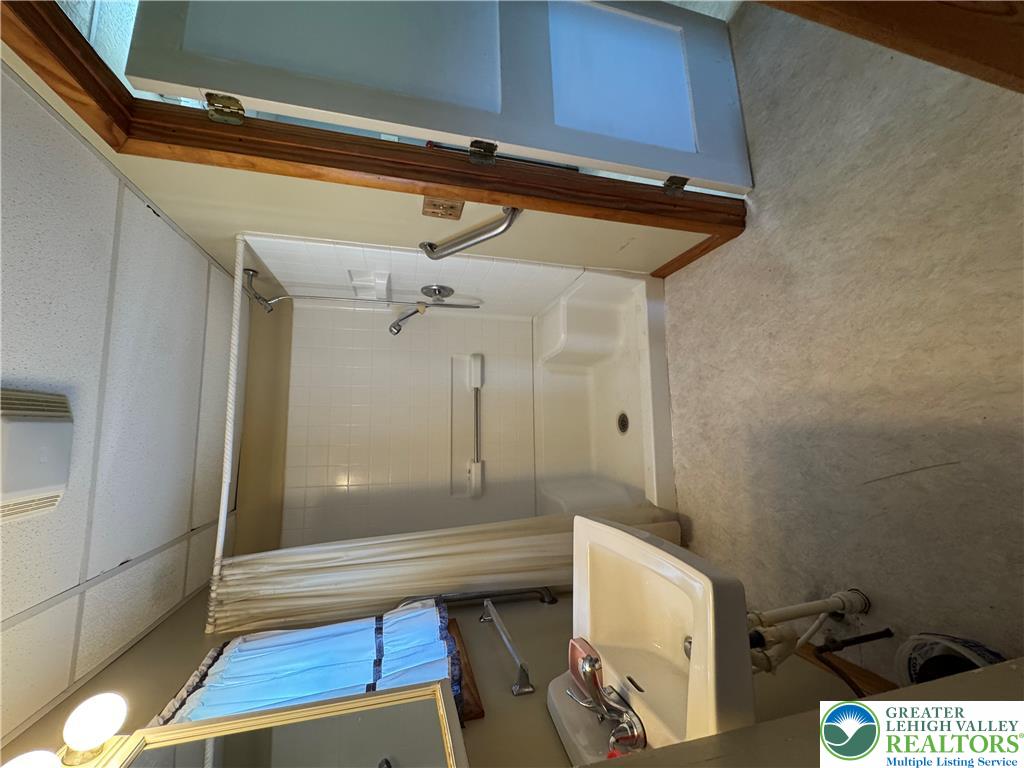 868 Catawissa Road Tamaqua, PA 18252 - Photo 23 of 67 Functional bathroom features a shower and a single vanity for daily convenience.