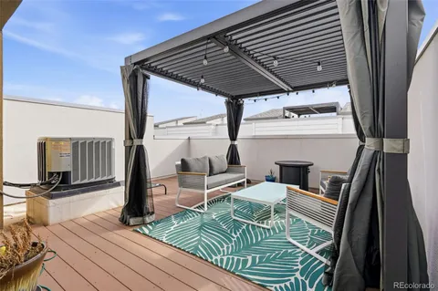 a view of a balcony next to a yard